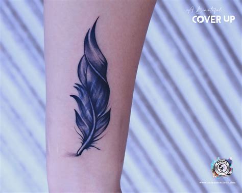 cover up black heart tattoo|feather tattoo cover up ideas.